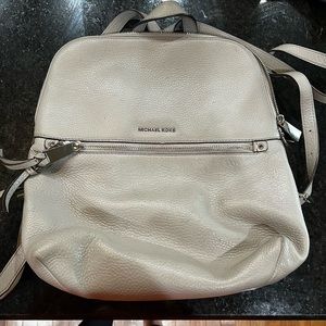 Gray Michael Kors medium backpack.